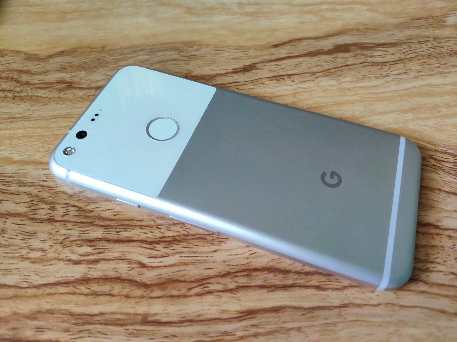 The back of a white first-generation Google Pixel phone.